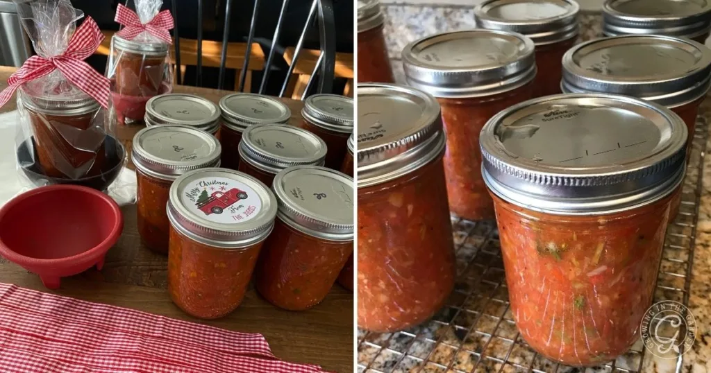 Jars of homemade salsa and sauce, some with festive lids and ribbons, featuring our favorite garden salsa recipe, on a kitchen table and cooling rack.
