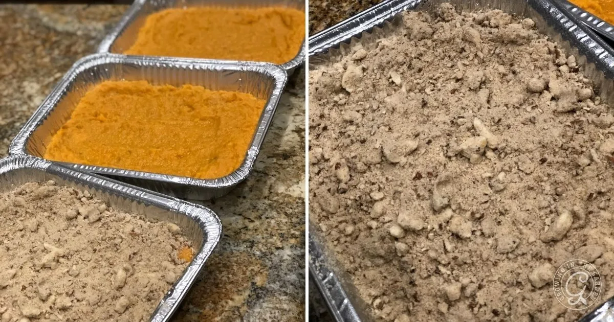 Three foil trays with sweet potato mixture, including a make ahead sweet potato casserole topped with crumbly streusel, sit neatly on the kitchen counter.