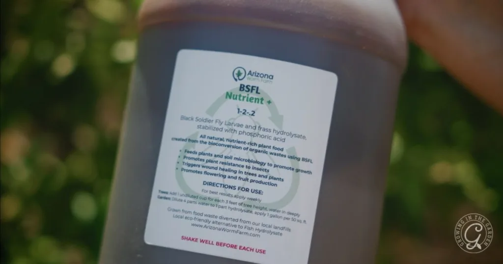 A bottle labeled BSFL Nutrient with clear instructions on how to use Nutrient+ and branding from Arizona Worm Farm.